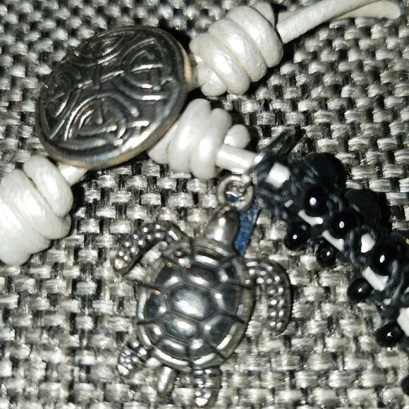 Bracelet with Rhinestones Set in Black Beads with White Tie and Turtle Charm - Picture 6 of 9